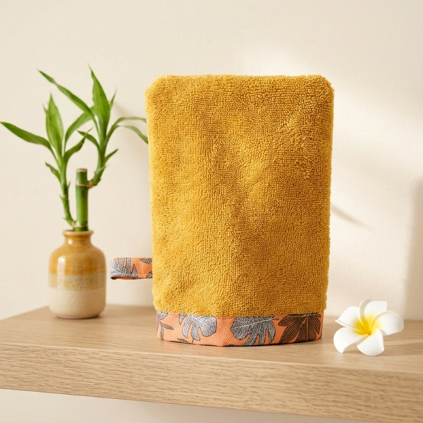 Gant de toilette adulte en éponge de bambou, présenté en photo produit sur fond neutre, idéal pour une toilette douce et respectueuse de la peau